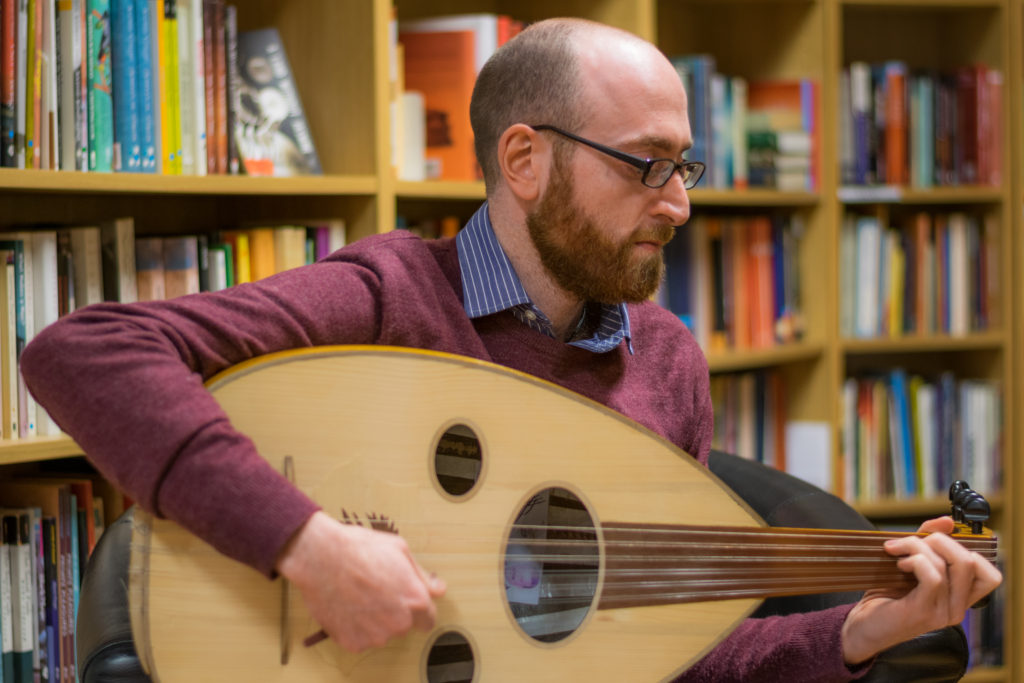 Ahmed Mukhtar performing on oud with the Taqasim Ensemble