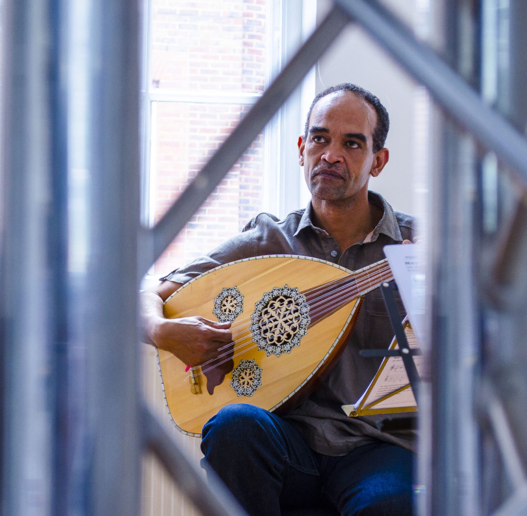 Oud silhouetted against a window